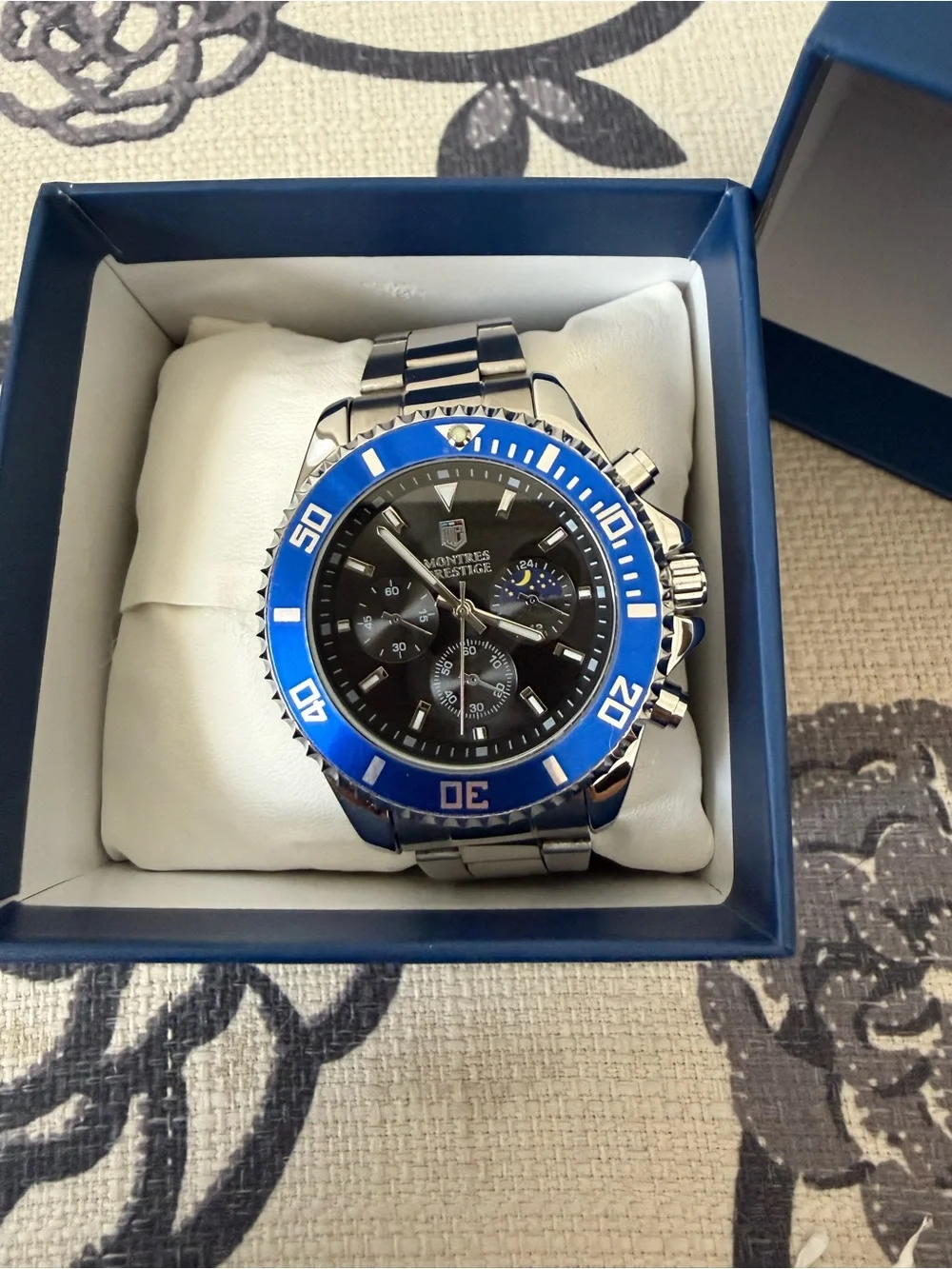Montres Prestige Men’s Quartz Chronograph 24-Hr Black Dial Blue Bezel w/ Box